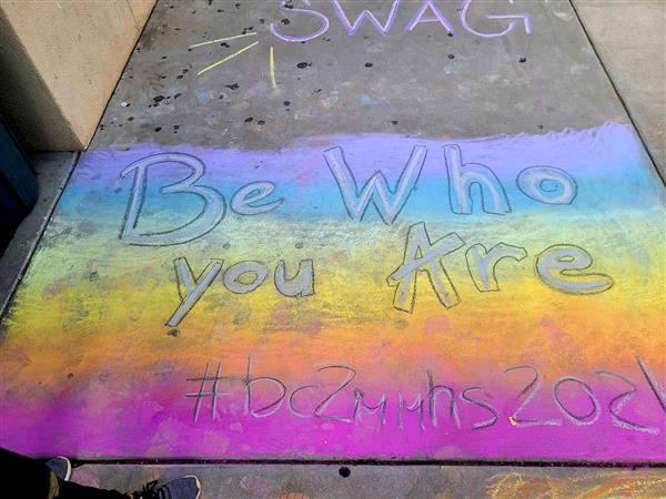Be Who You Are written in chalk on the sidewalk